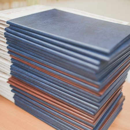 Stack of School Diploma with leather covers